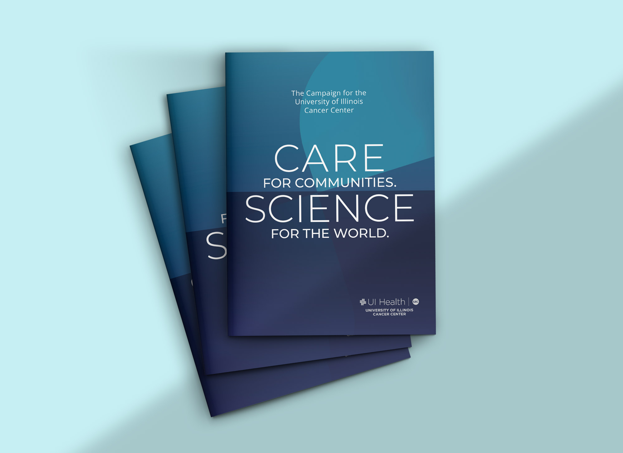 Top-down image of three stacked case covers. The title reads, "Care for Communities. Science for the World. The campaign for the University of Illinois Cancer Center."