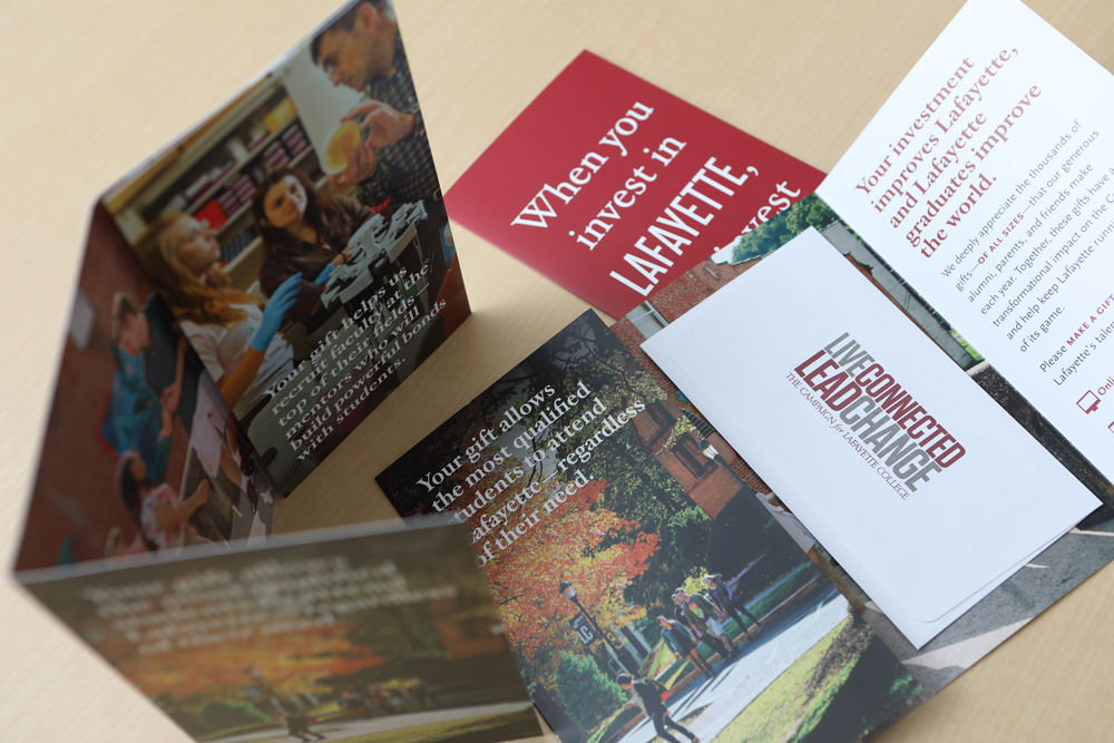 Photo of print pieces from the Live Connected Lead Change campaign